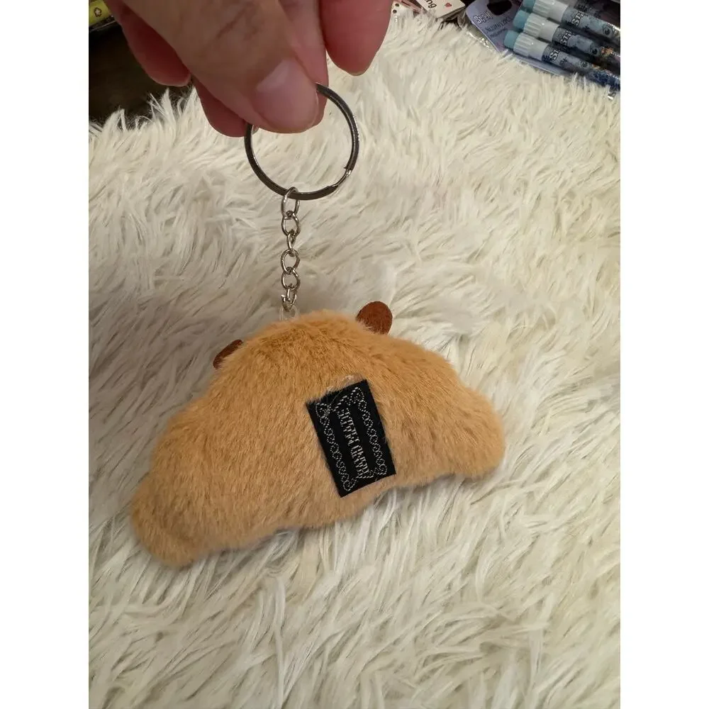 Capybara croissant plush keychain with embroidered  face and orange cheeks